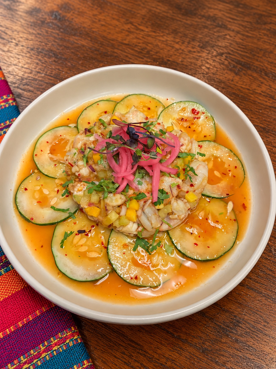 Shrimp ceviche with cucumber, citrus, pickled onion and herbs